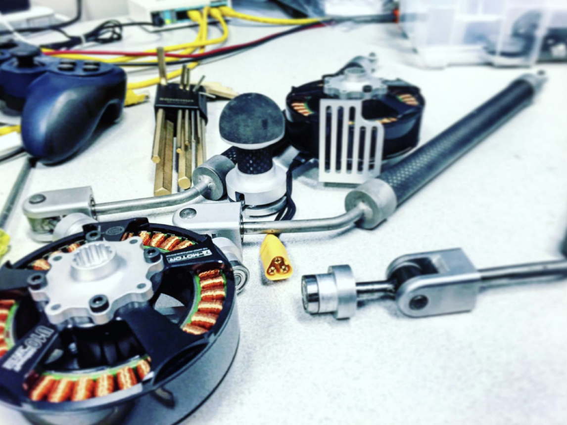 QDD actuator modules with T-Motor U10 motors and 3-RSR linkages during GOAT assembly